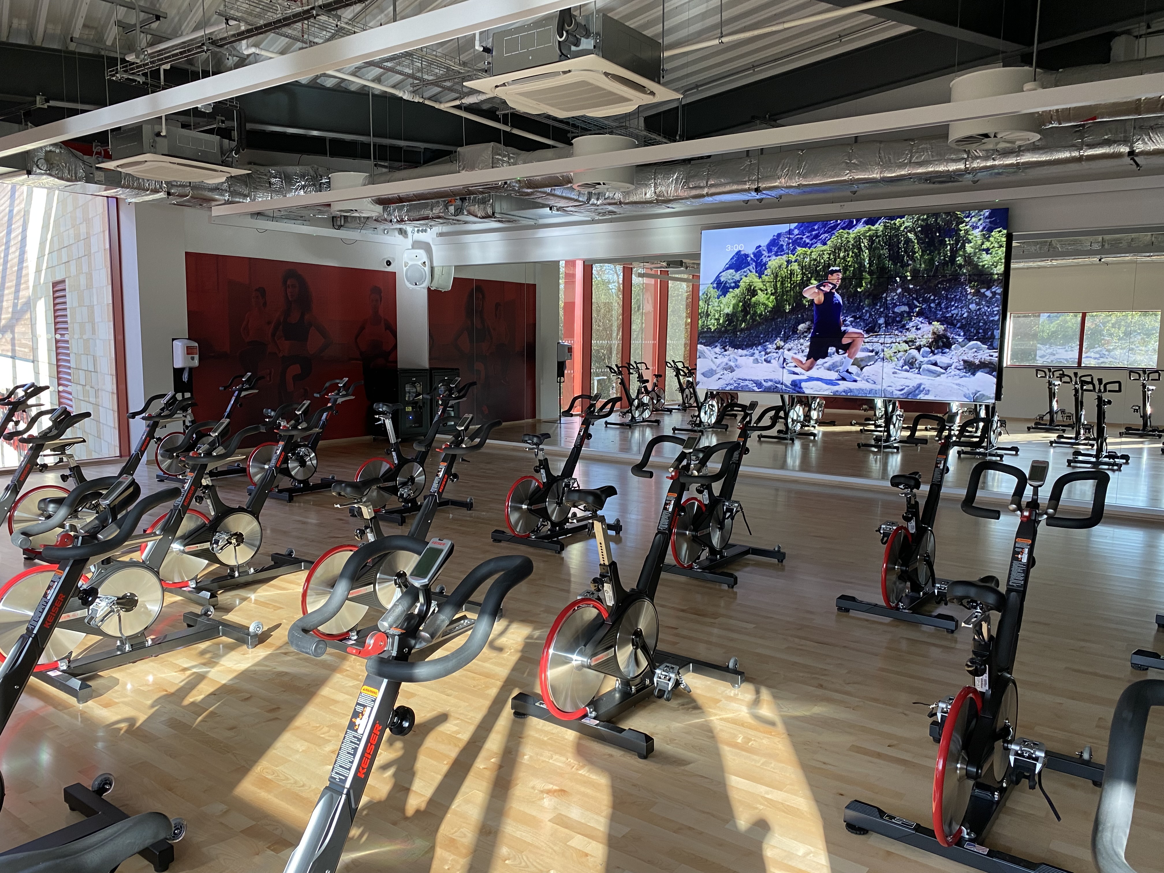 Virtual workout room at Grange Paddocks including large screen and lots of exercise bikes