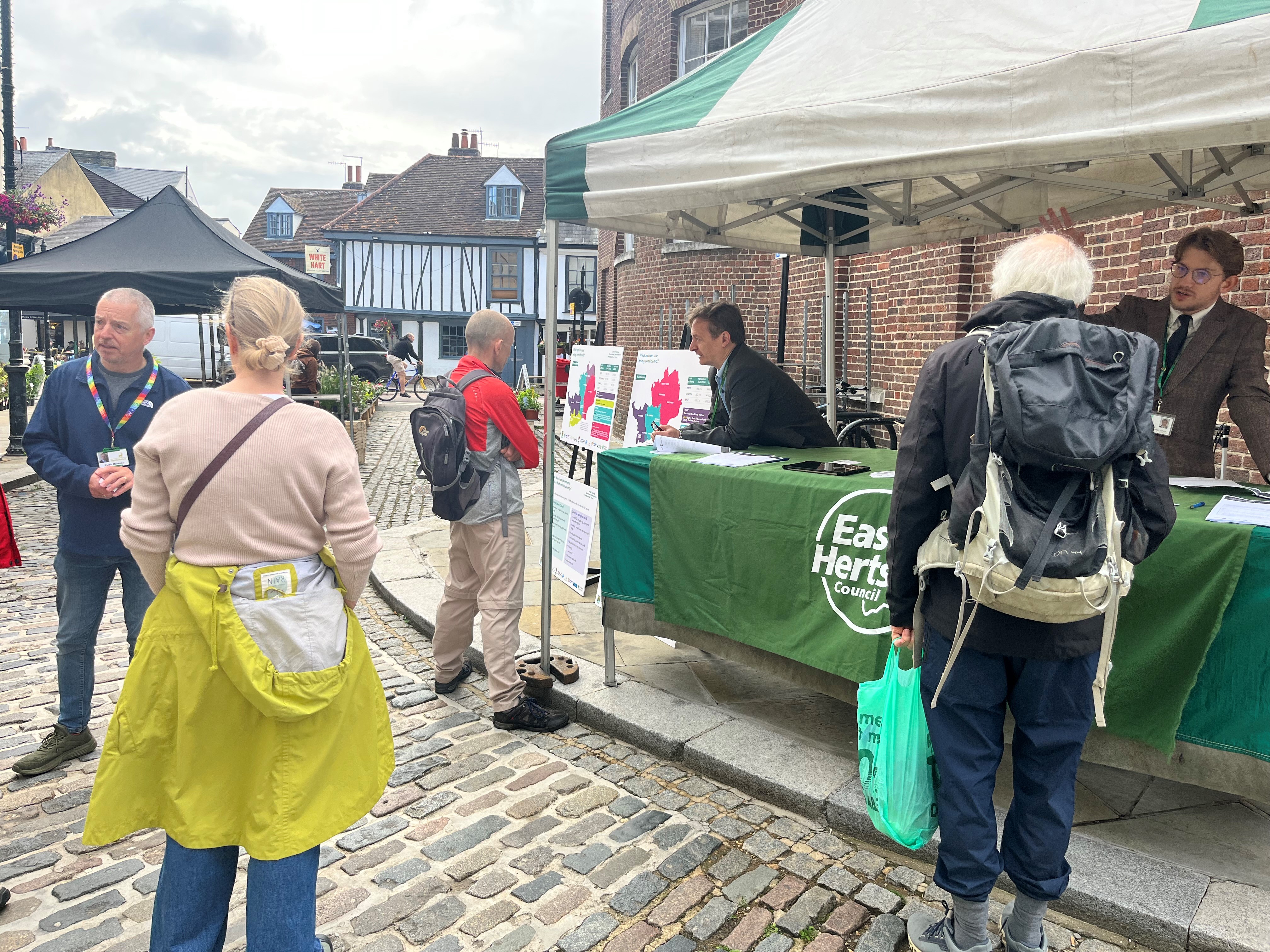 A market stall in Hertford engaging passers by with option maps and information