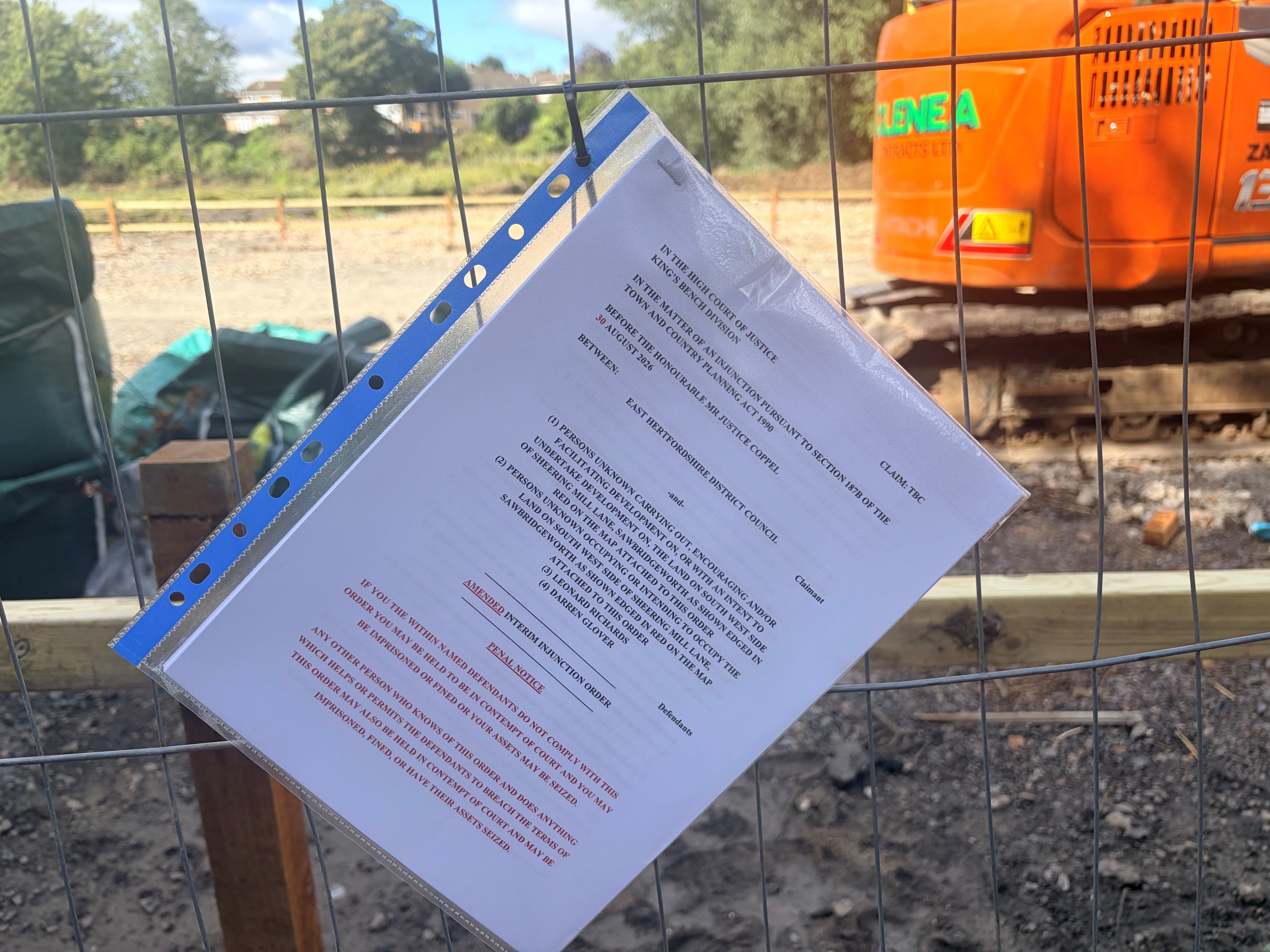Paper order placed on fence of site of works