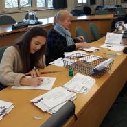 two ladies working at desk on postal votes for election
