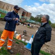 Eric Buckmaster (on right) pictured on a site visit to the archaeological excavations at Grange Paddocks. Talking to one of the archaeologists.