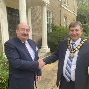 Councillors Ken Crofton and Ian Devonshire shaking hands