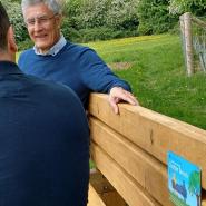 pictured is Eric Buckmaster talking to someone on one of the new chatter benches