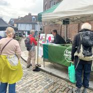 A market stall in Hertford engaging passers by with option maps and information