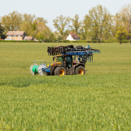 Farmer harvesting their field in a machine